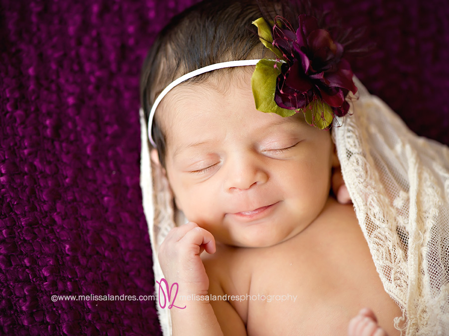 newborn baby smiles