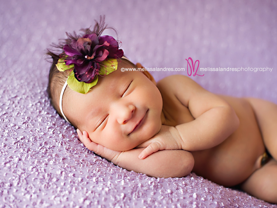 smiling-sleeping-newborn-baby