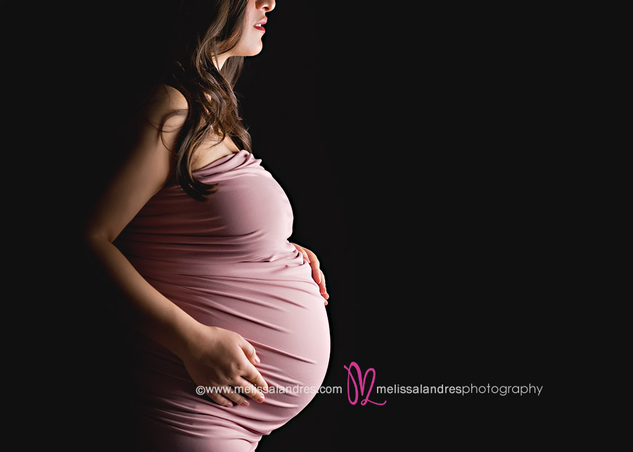 Stunning maternity silhouette with dramatic portrait lighting by La Quinta photographer Melissa Landres
