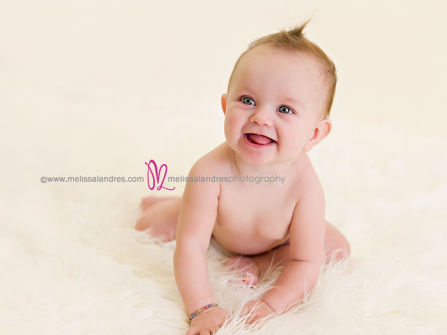 cute-baby-girl-6-months-old-smiling-by-professional-photographer-melissa-landres