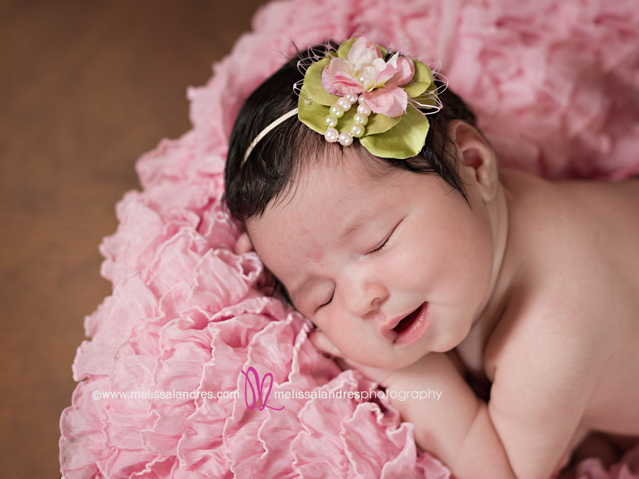 Smiling newborn baby photo by professional Maternity and newborn photographer Melissa Landres
