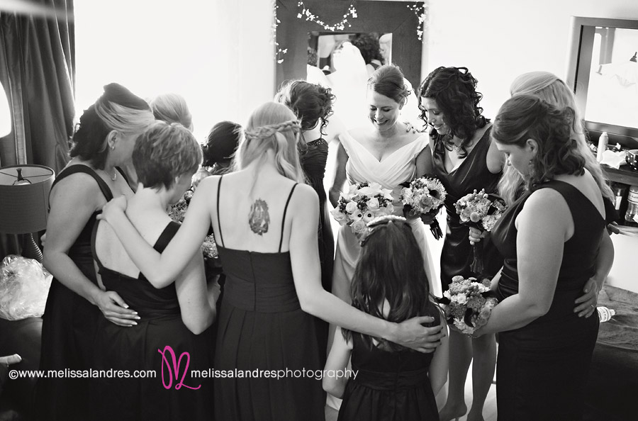 Bride and her bridesmaids prayer before the wedding by photographer Melissa Landres