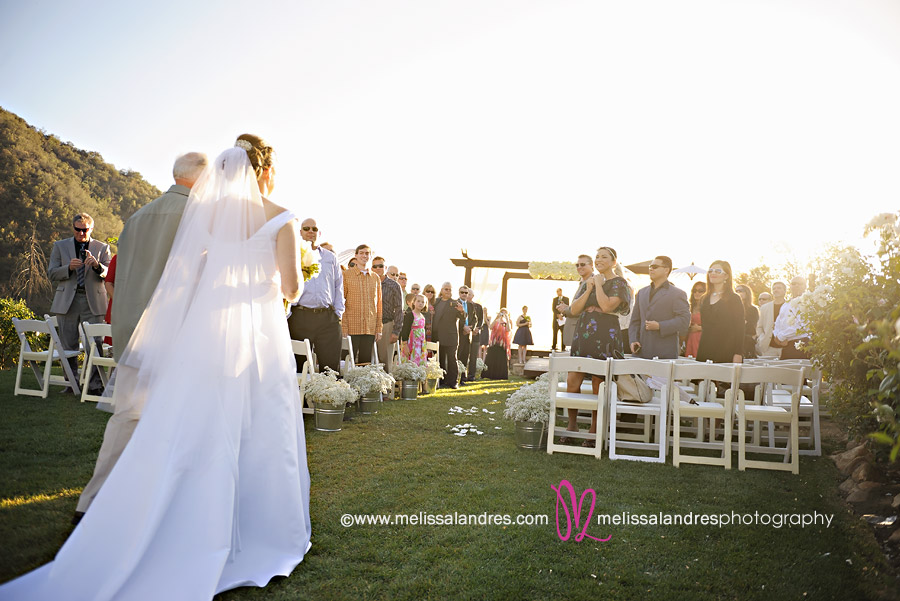 Bride walking down the isle to be married by La Quinta wedding photographer Melissa Landres