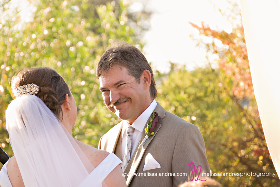Close up of groom looking at the bride by wedding photographer Melissa Landres