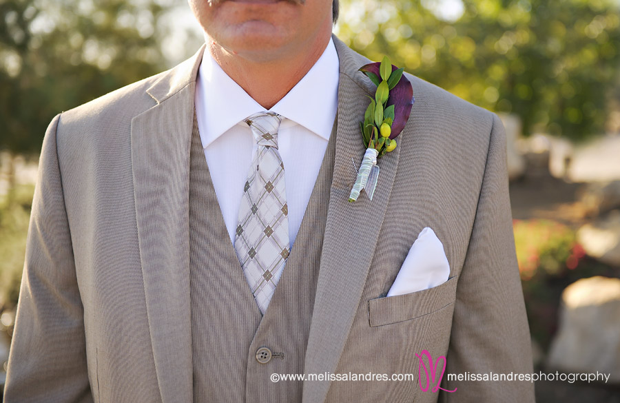 Close up of the grooms ties and boutonniere by Wedding photographer Melissa Landres