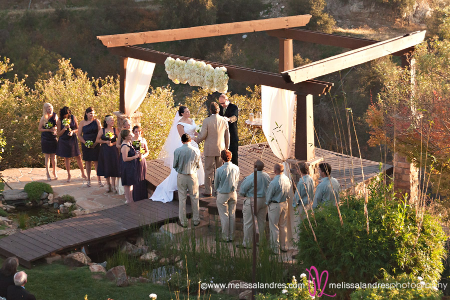 wide shot of outdoor wedding, Bride and groom at the altar by professional La Quinta wedding photographer Melissa Landres