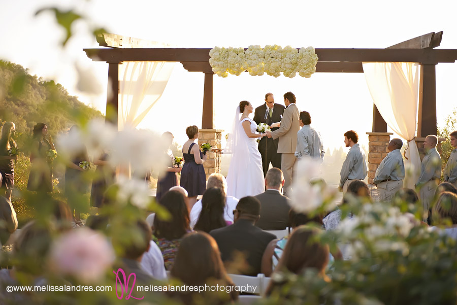 Outdoor wedding, Bride and groom at the altar by professional La Quinta wedding photographer Melissa Landres