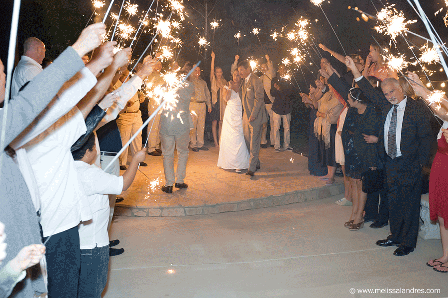 End of the wedding, bride and groom sparkler send off by photographer Melissa Landres