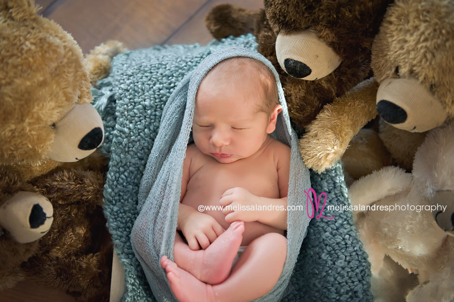 Newborn baby boy with his teddy bear stuffed animals by La Quinta baby photographer Melissa Landres