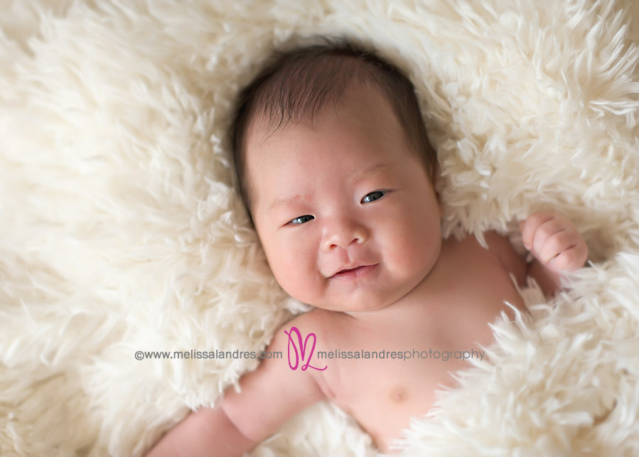 cute newborn baby boy smiling