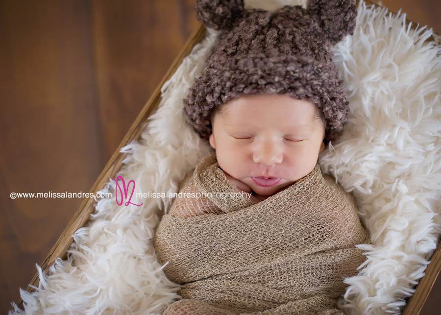 baby with teddy bear knit hat by La Quinta newborn photographer Melissa Landres