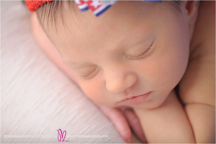 close up of brand new baby's face, lips, and eyelashes