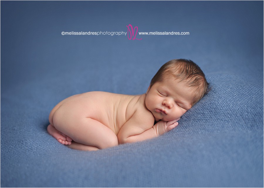 baby boy on blue blanket for newborn photos