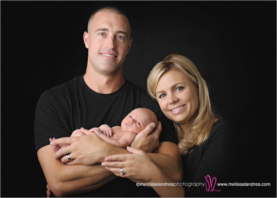 professional family photos with newborn baby, mom and dad and baby boy