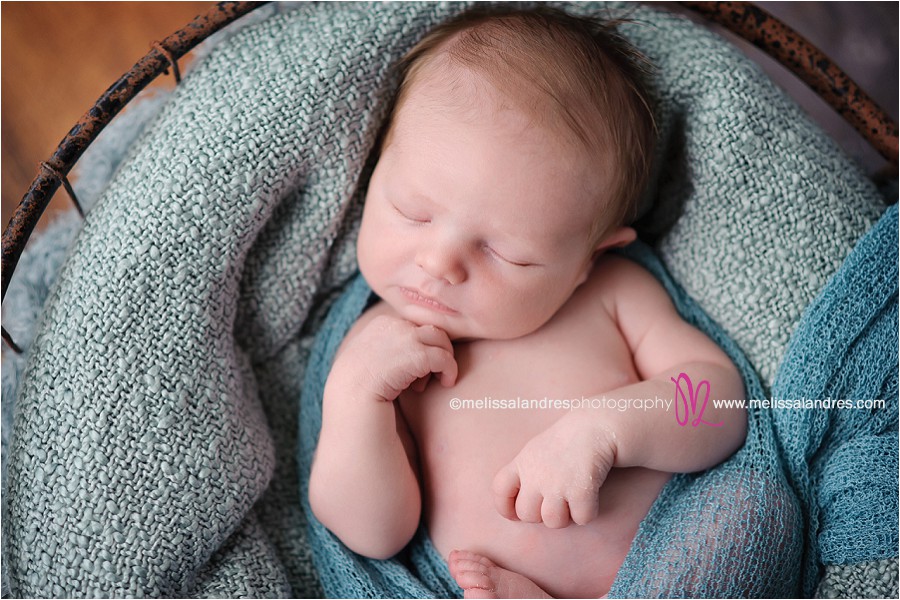 cutest Newborn baby props and poses; baby in a basket by La Quinta baby photographer Melissa Landres