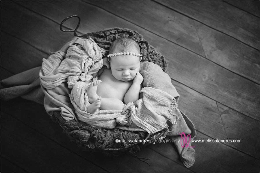 Newborn baby snuggled in basket prop, rhinestone headband, classic black and white la quinta baby photos, baby as art