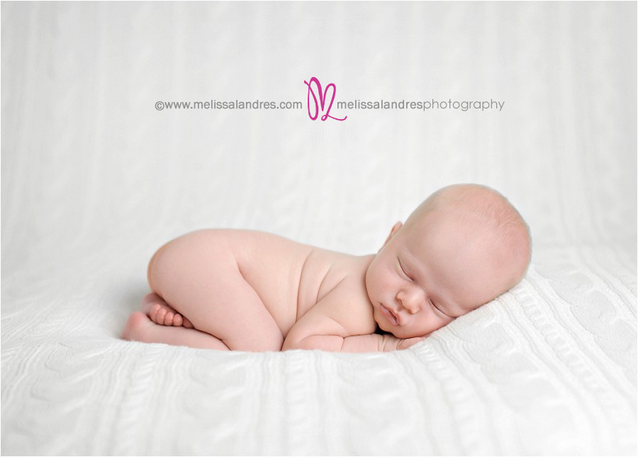 perfect little angel photo of newborn baby sleeping on white blanket