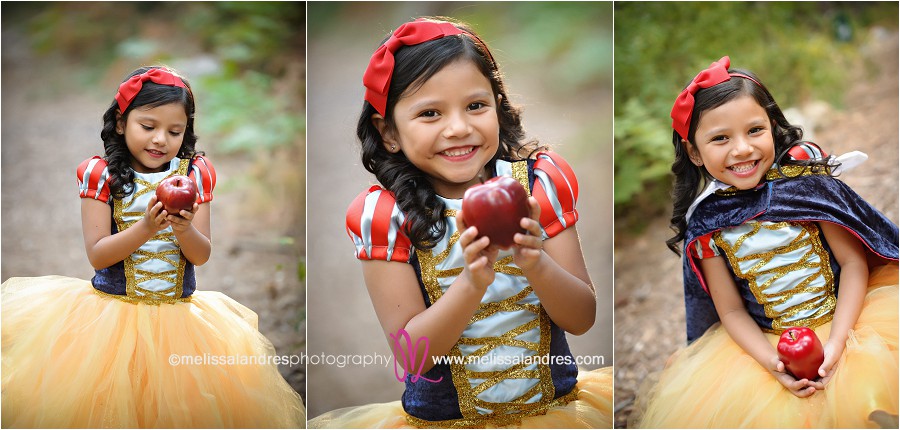Girl in snow white costume with apple in the forest, theme photo session by child photographer Melissa Landres