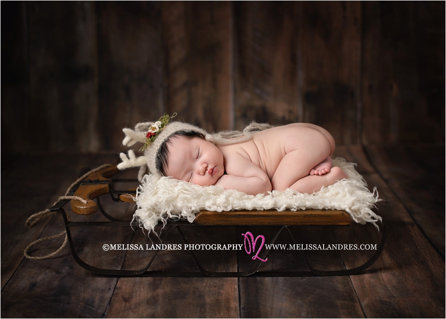 adorable baby reindeer on sleigh prop, Palm Desert baby photos Melissa Landres Photography